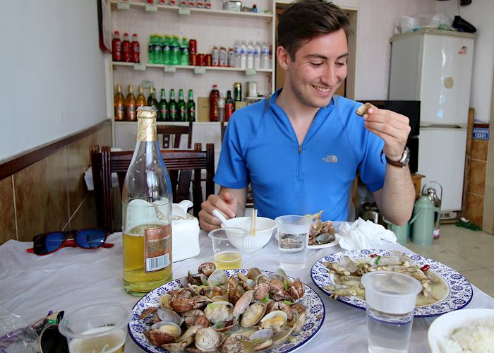 Anthony eating at a local restaurant in Qingdao, China 