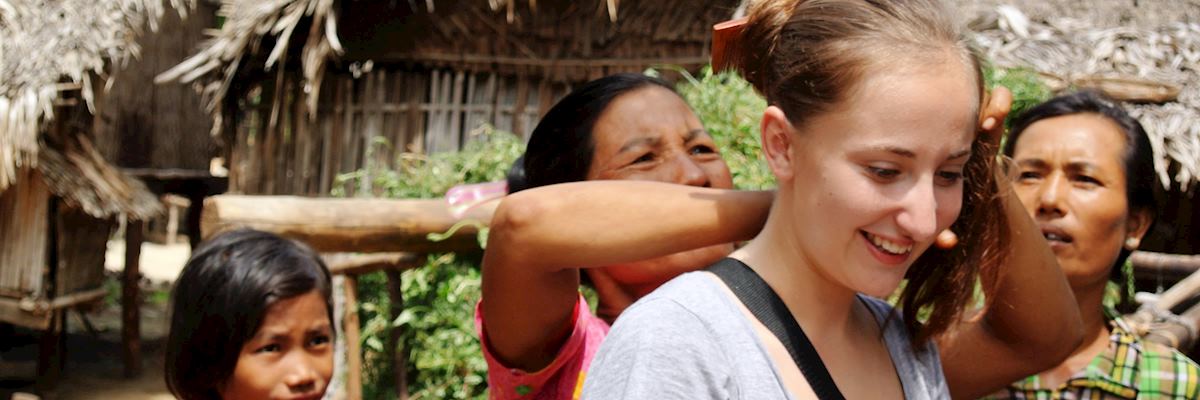 Audley specialist Hannah having her hair wrapped by locals into a Burmese bun in Pagan, Burma Audley specialist Hannah having her hair wrapped by locals into a Burmese bun in Pagan, Burma