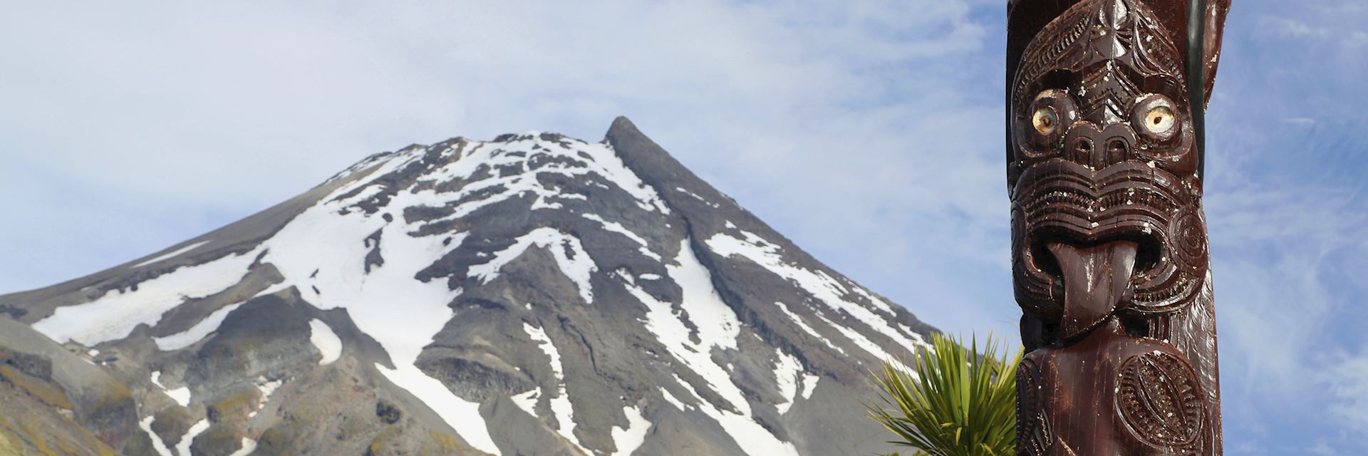 Maori carving against Volcano Taranaki