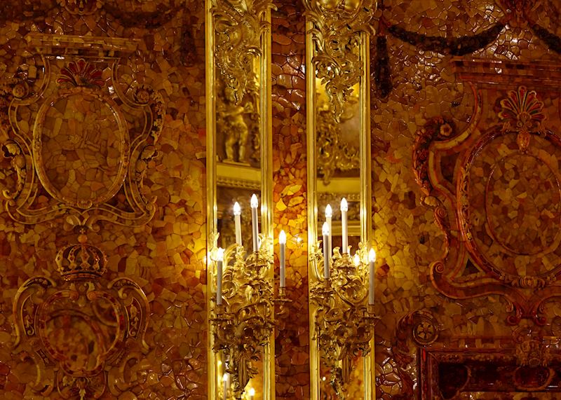 The sparkling Amber Room in Catherine Palace in Tsarkoe Selo, 15 miles from St Petersburg