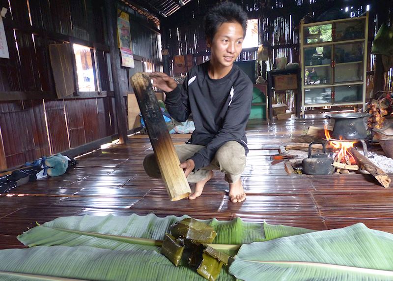 Meet the locals: Many of the Lahu tribe wear traditional black and red clothing and live in stilted wooden houses.