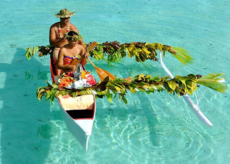 Breakfast delivered by canoe, Le Taha’a Private Island and Spa.