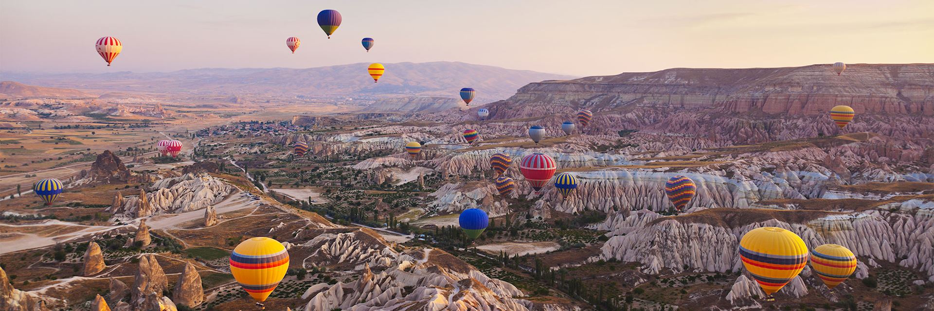 Hot air balloons floating over Cappadocia