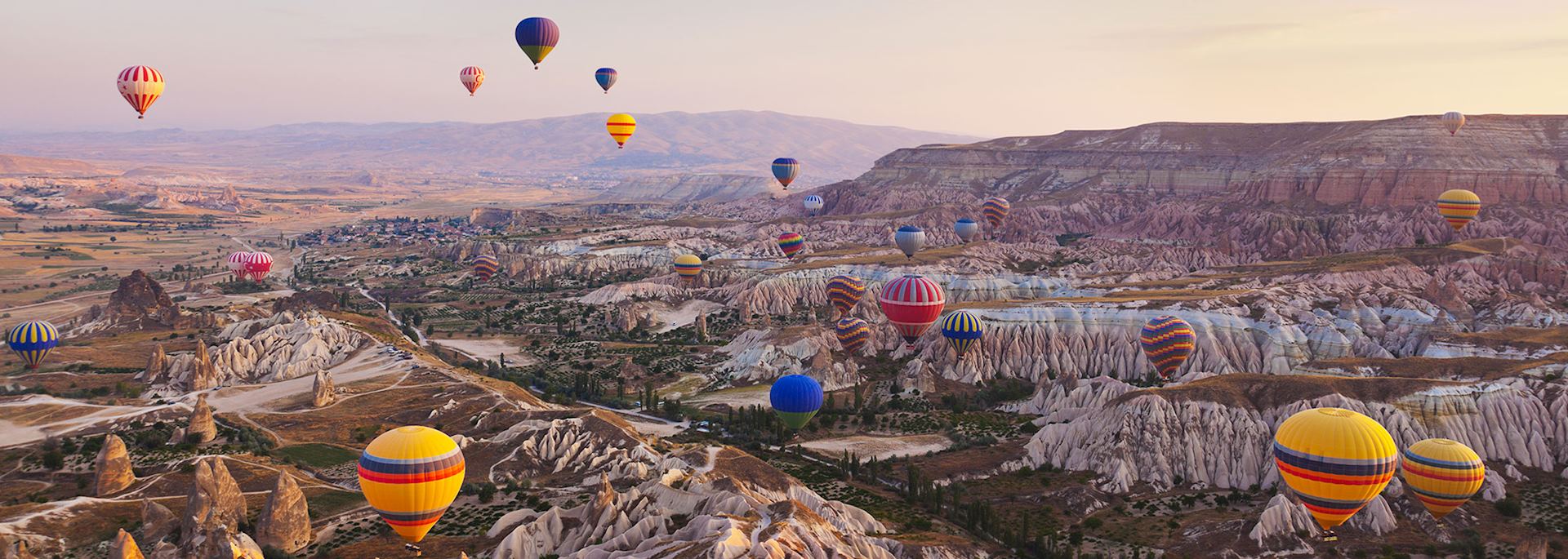 Hot air balloons floating over Cappadocia