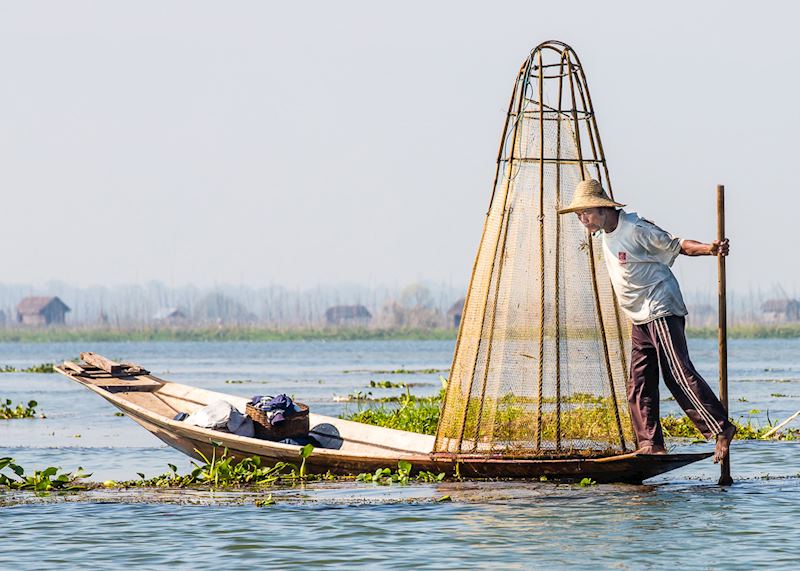 Take some time to watch the fishermen on Inle Lake with their unique leg-rowing technique