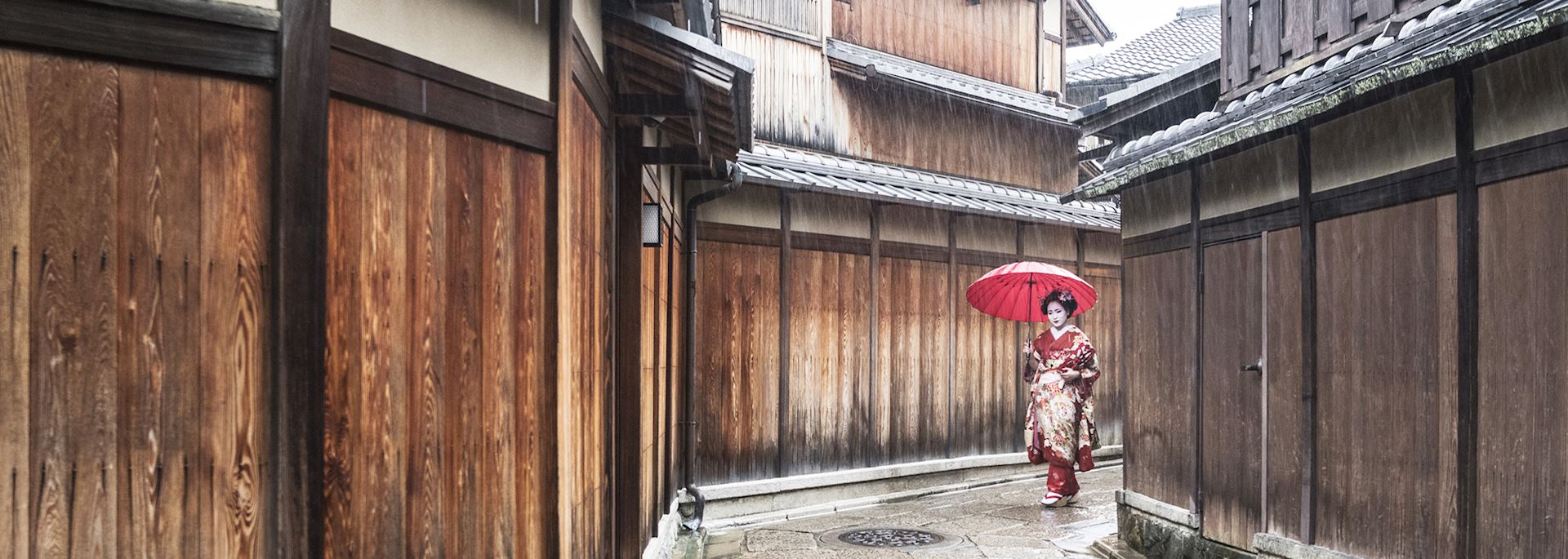 Geisha walking through a Japanese village