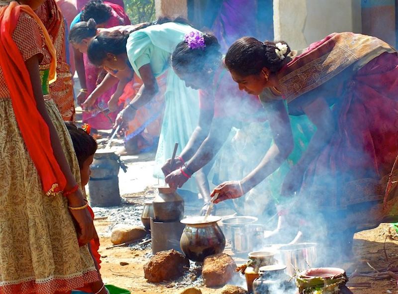 Indian ladies boiling sweet rice in Karaikudi, India