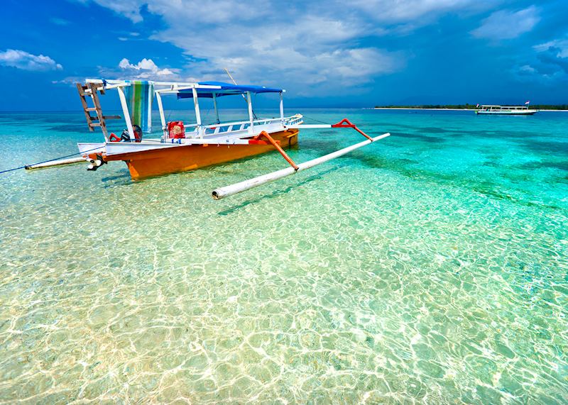 Traditional boat in the shallow waters of Gili Meno, Indonesia