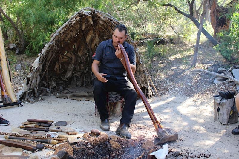 Josh playing the didgeridoo outside the spiritual Ngilgi Cave