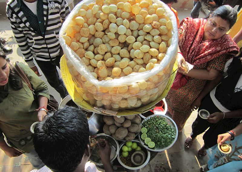 People enjoying golgappa, an Indian street food in Calcutta