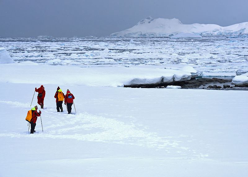 Passengers walking through the snow