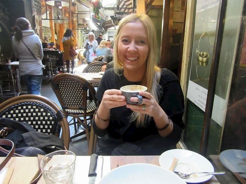 Audley Australia specialist Alice drinking coffee in Melbourne