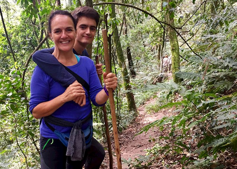 Rebecca and her son trekking to see the gorillas — © Rebecca Harvey
