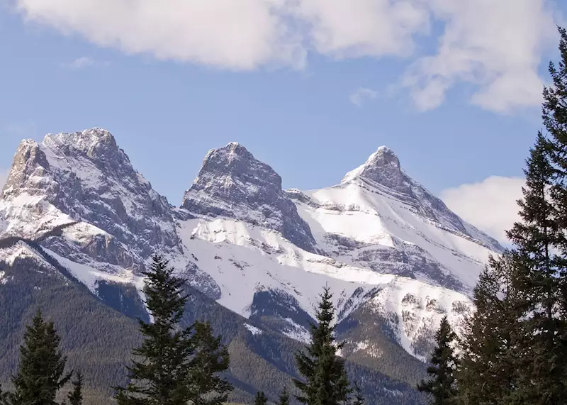 Three Sisters Mountain Range viewed over the Bow River