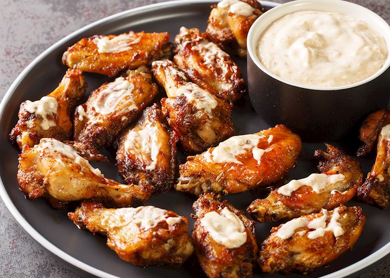 Grilled chicken wings with white barbecue sauce, Alabama