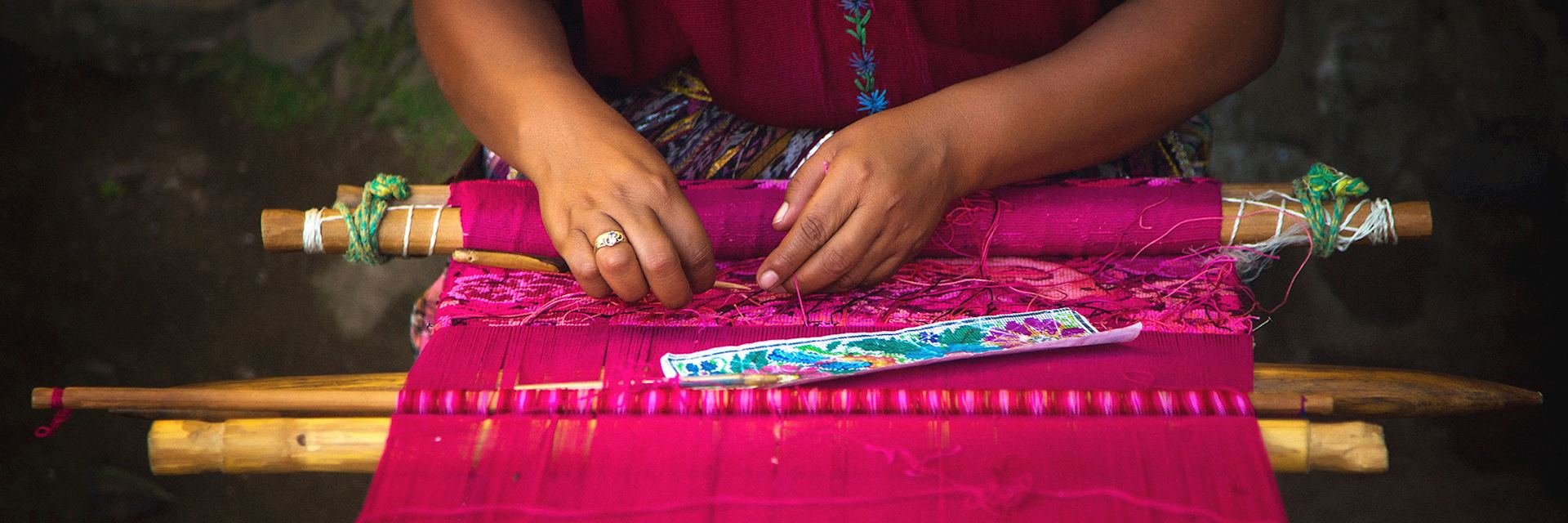 Woman weaving on a loom in Guatemala