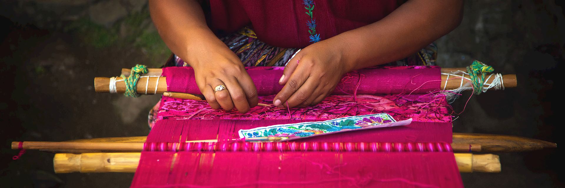 Woman weaving on a loom in Guatemala
