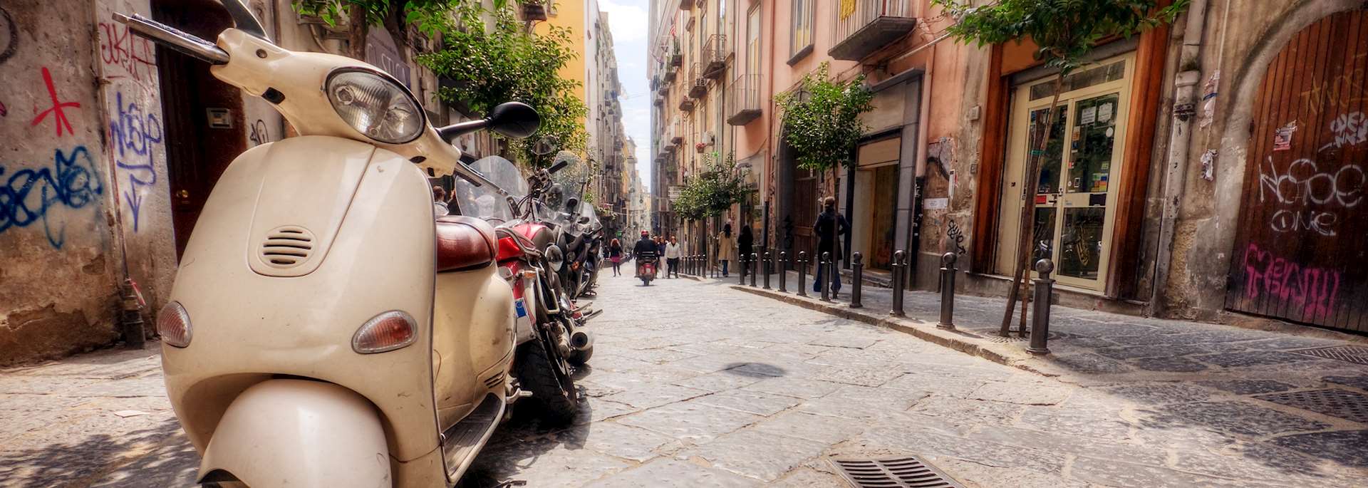Vespas on a street in Naples