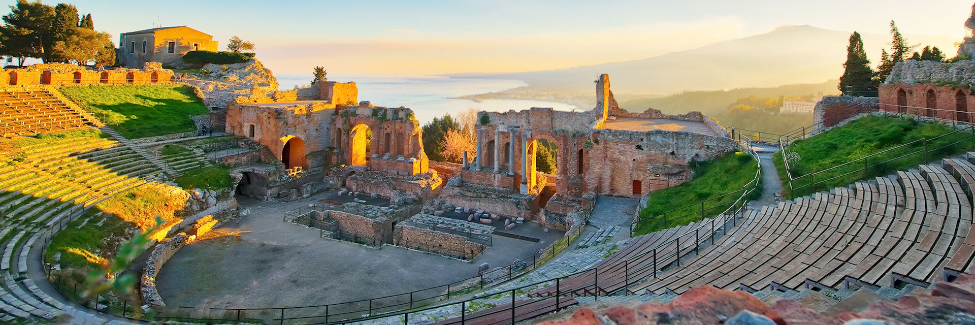 Ancient theatre of Taormina with Etna in the distance