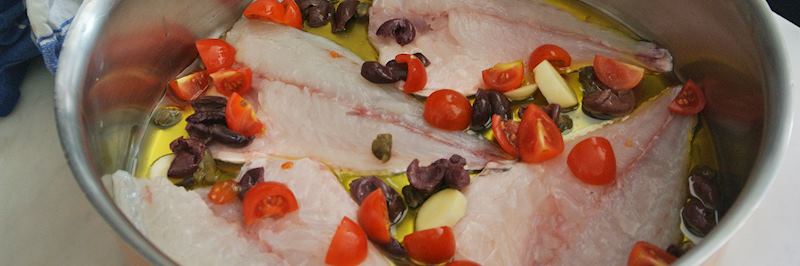 Cooking fish at Casa Laura's