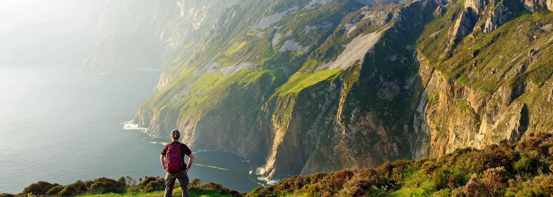 Hiker on the Slieve League cliffs
