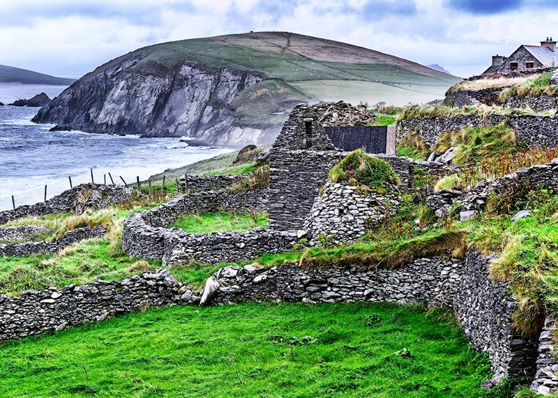 Ruined stone dwelling with beehive hut on the Dingle Peninsula