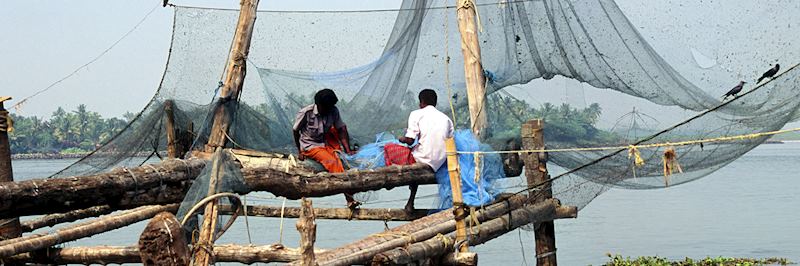 Fishermen working on their nets in Cochin