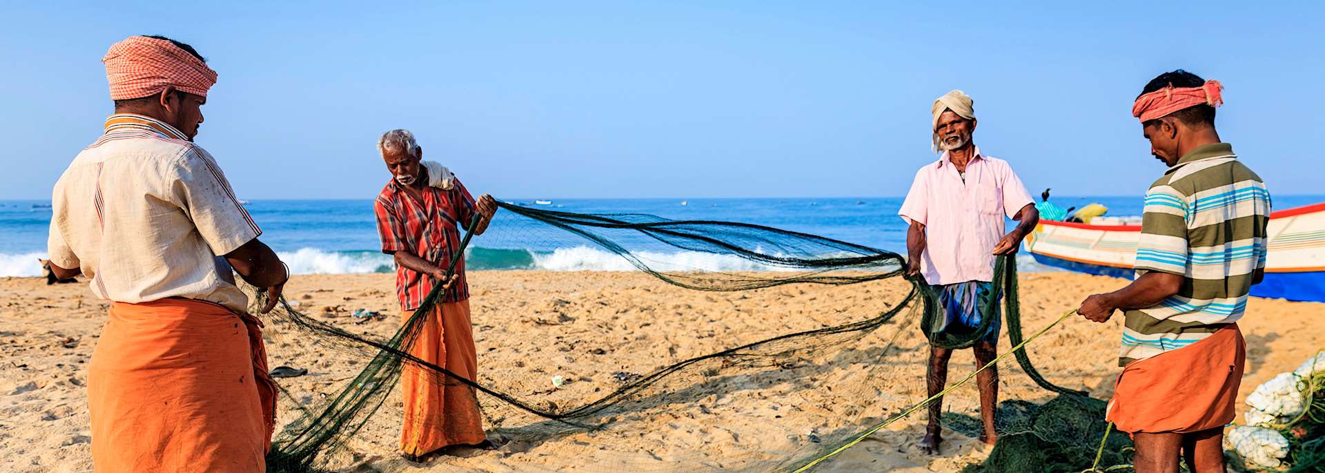 Fishermen on the beach in Cochin, Kerala
