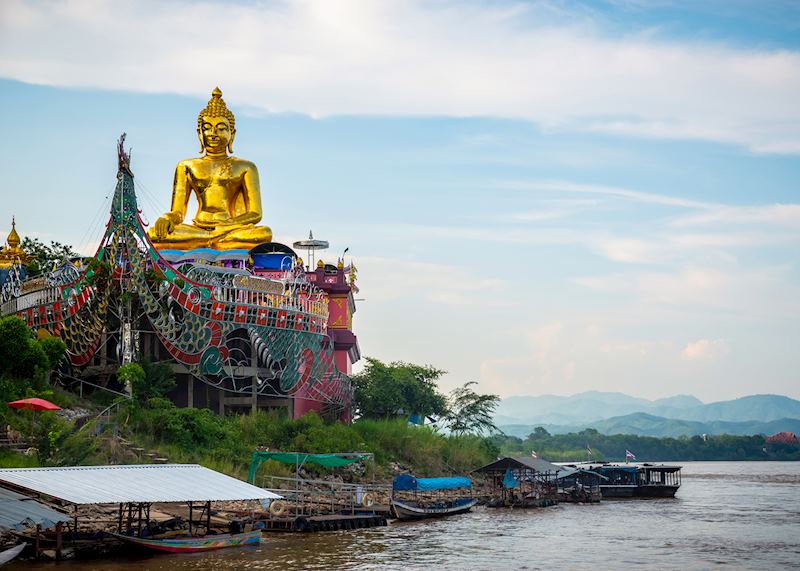 Golden Buddha next to the Mekong River at Chiang Saen, Thailand