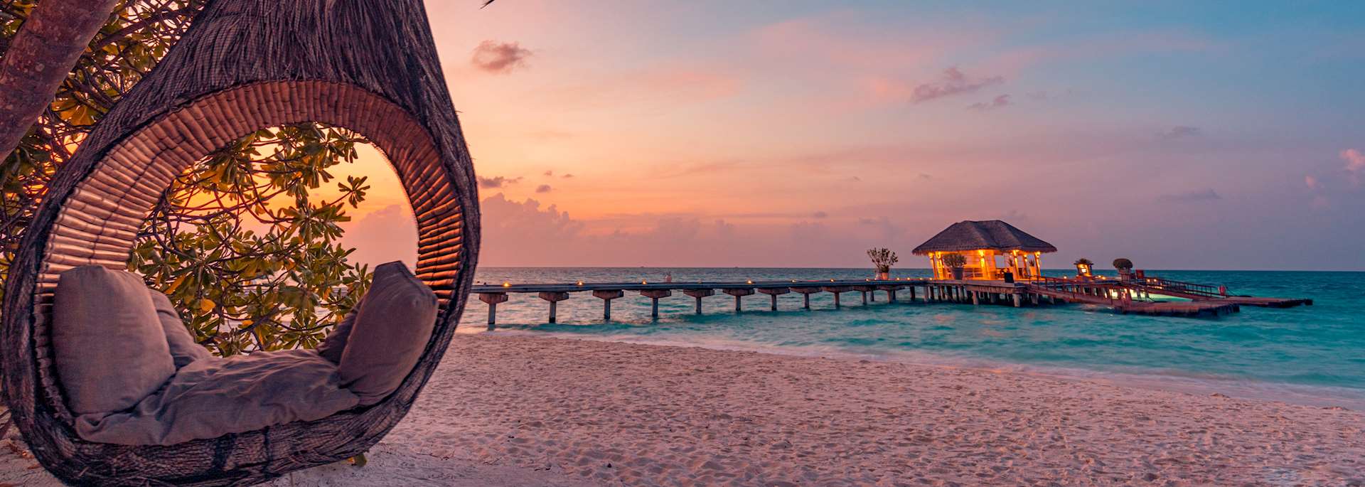 Romantic beach setting at sunset