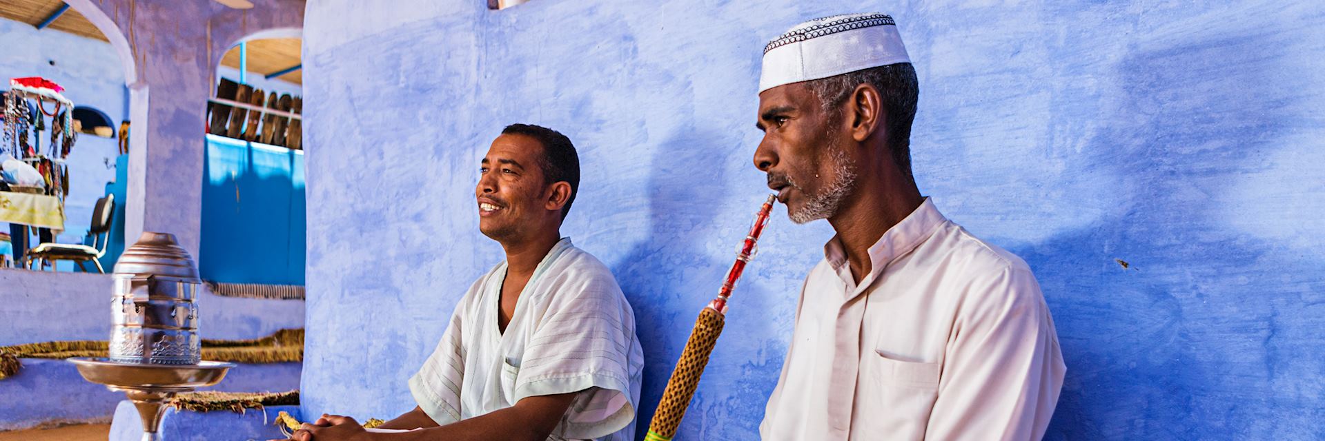 Nubian men smoking a waterpipe
