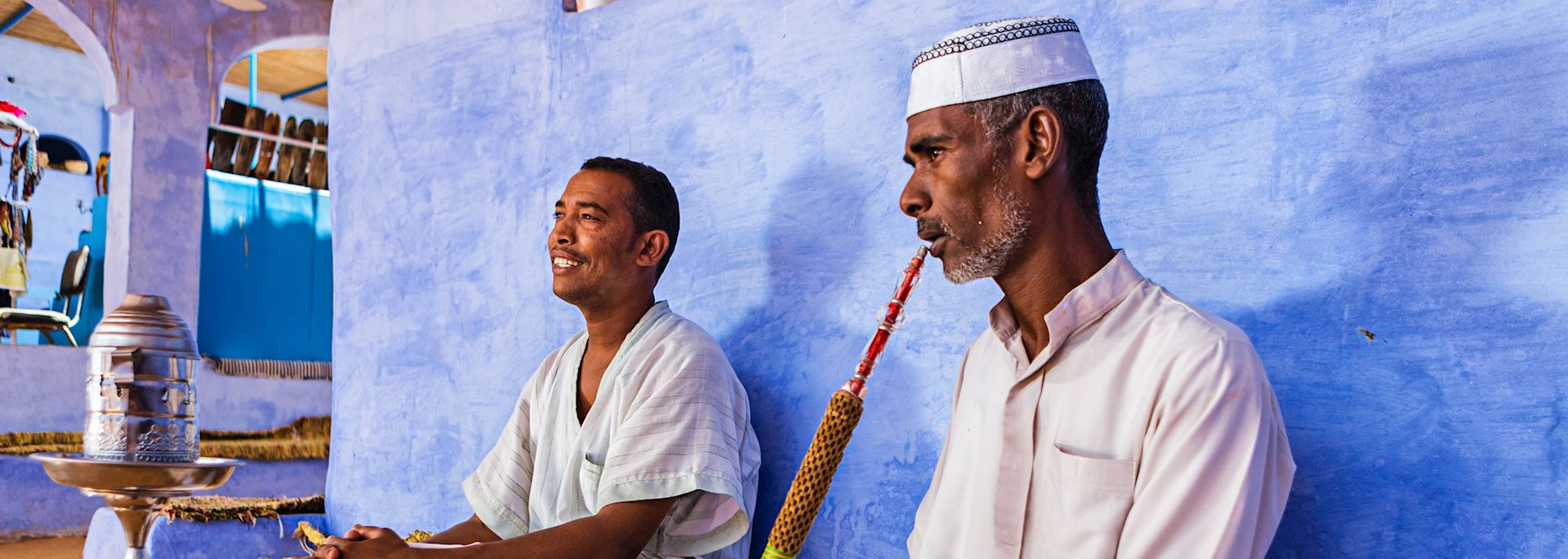 Nubian men smoking a waterpipe