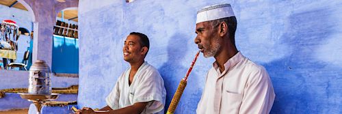 Nubian men smoking a waterpipe