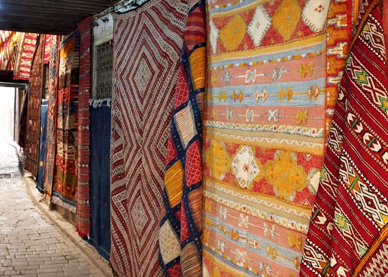 Moroccan rugs on display in the medina, Fez