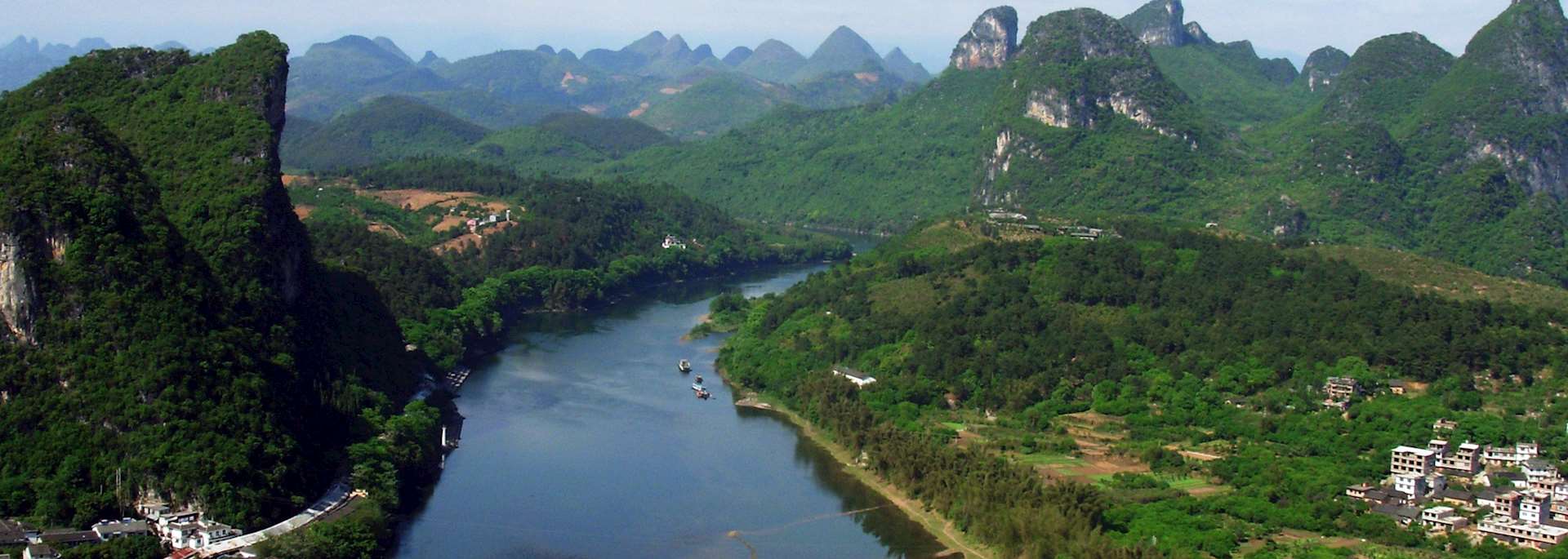 Cruise through the limestone pinnacles in Yangshuo