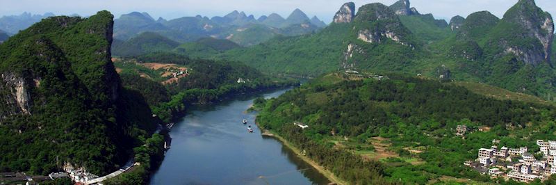 Cruise through the limestone pinnacles in Yangshuo