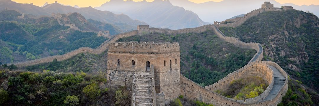 Dawn breaking over the Great Wall of China in Jinshanling