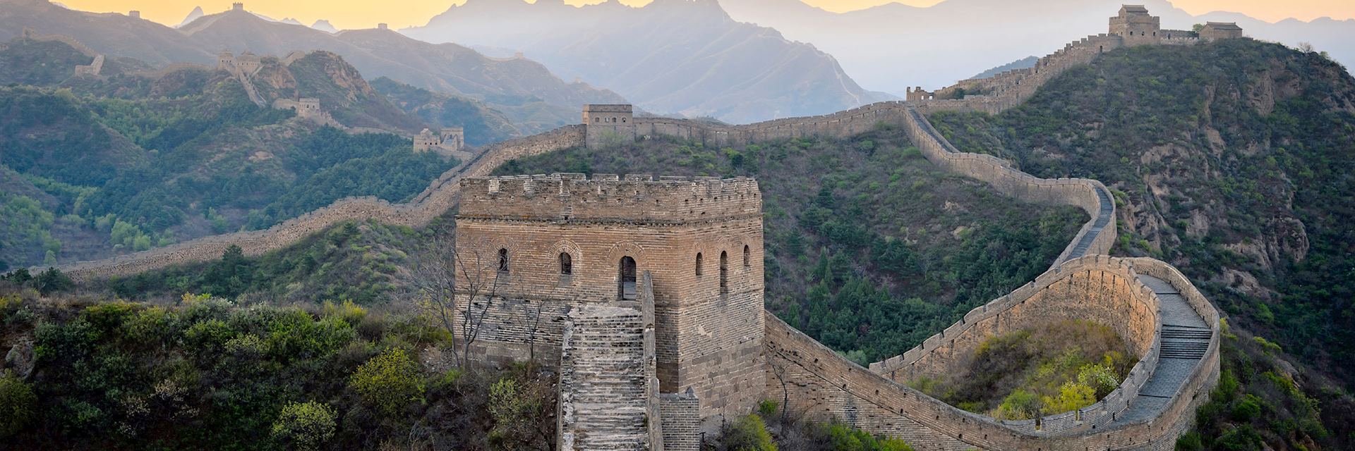 Dawn breaking over the Great Wall of China in Jinshanling