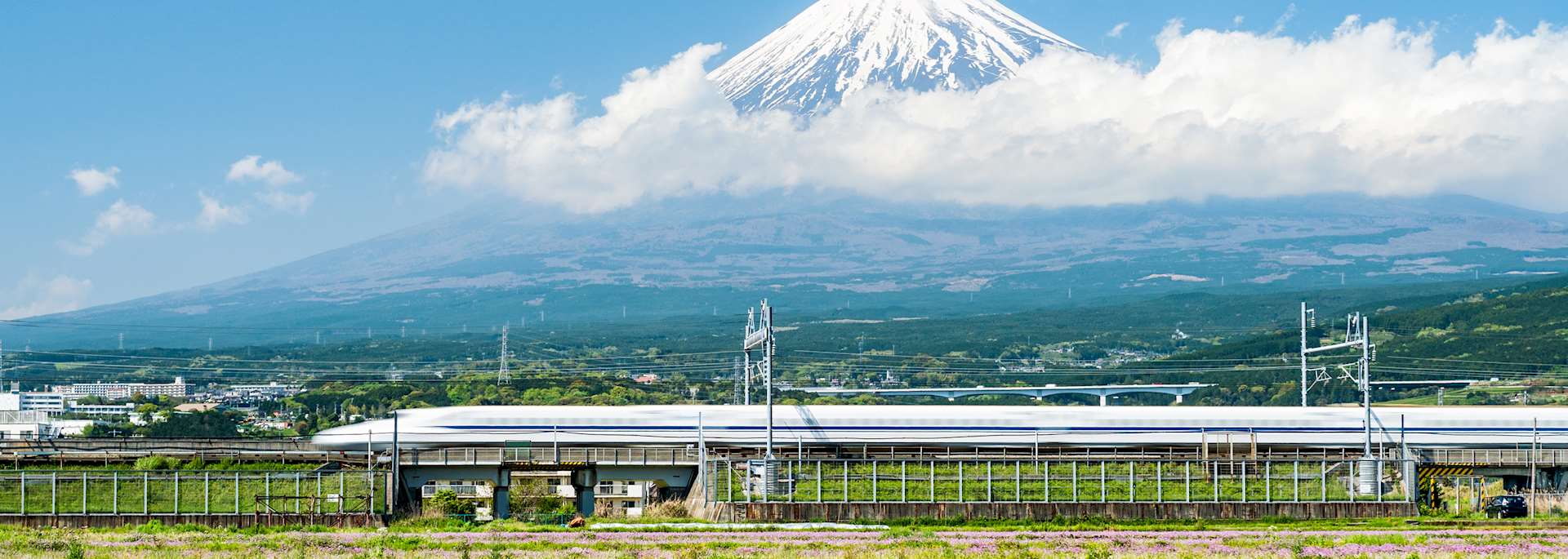 A bullet train passes Mount Fuji