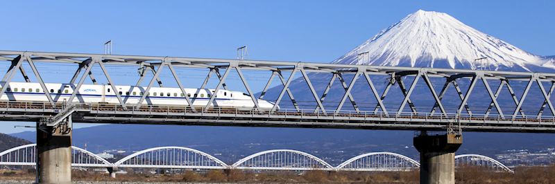 The Shinkansen, nicknamed the bullet train, passing Mount Fuji