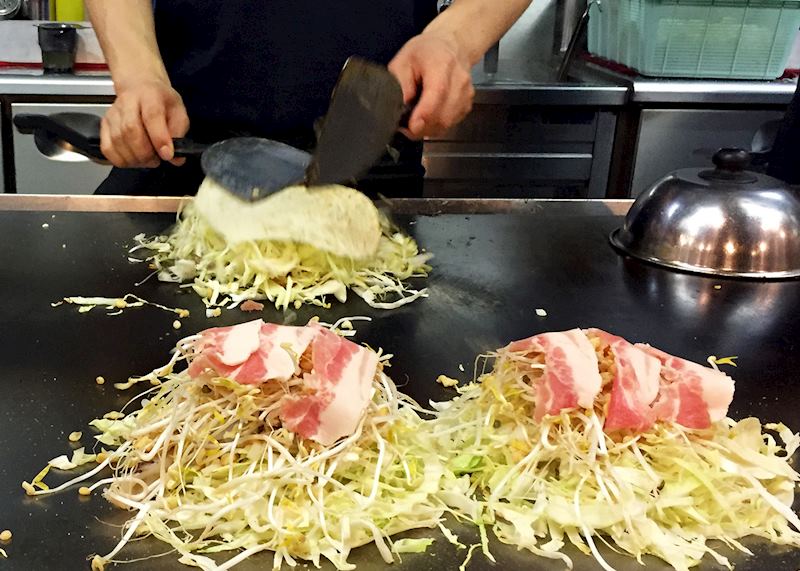 Okonomiyaki being cooked