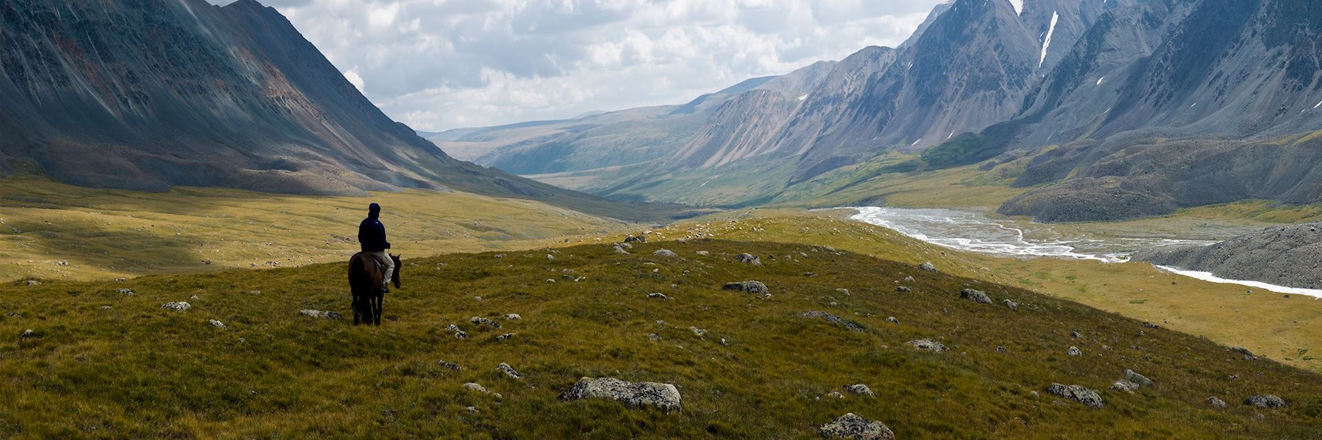 A lone rider in the Altay Mountains