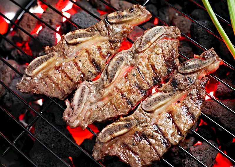 Korean galbi cooking on a charcoal fire