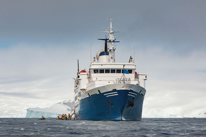 Passengers disembarking into zodiac boats