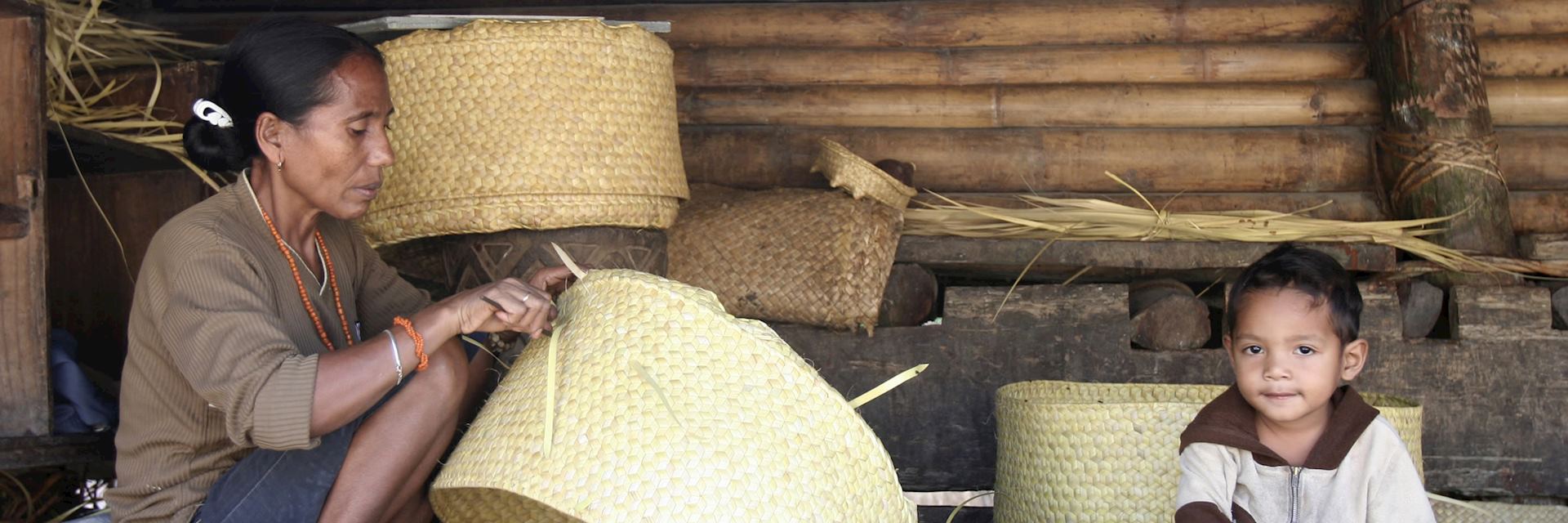 Woman weaving a basket, Sumba, Indonesia