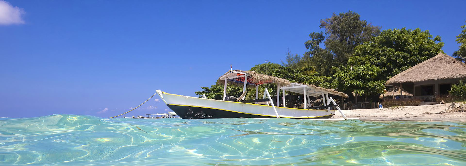 Long-tail boat moored off the Gili Islands