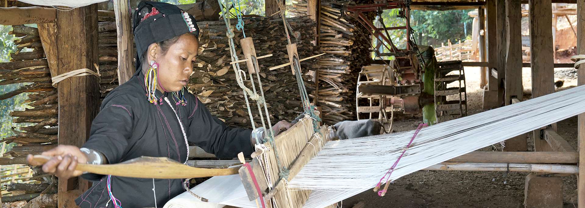 An tribe woman weaving cotton, Myanmar