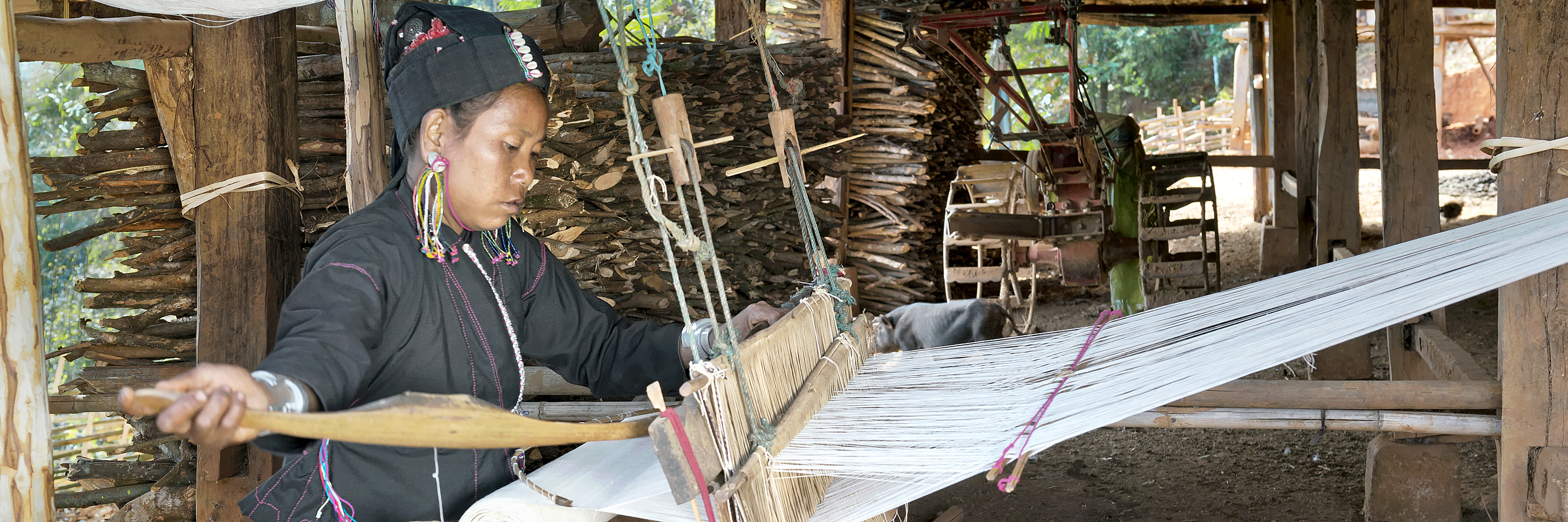 An tribe woman weaving cotton, Myanmar