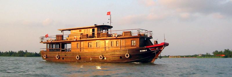 Bassac boat cruising on the Mekong