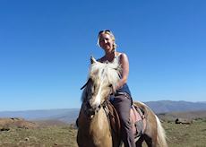 Anna horse riding in the Drakensberg, South Africa